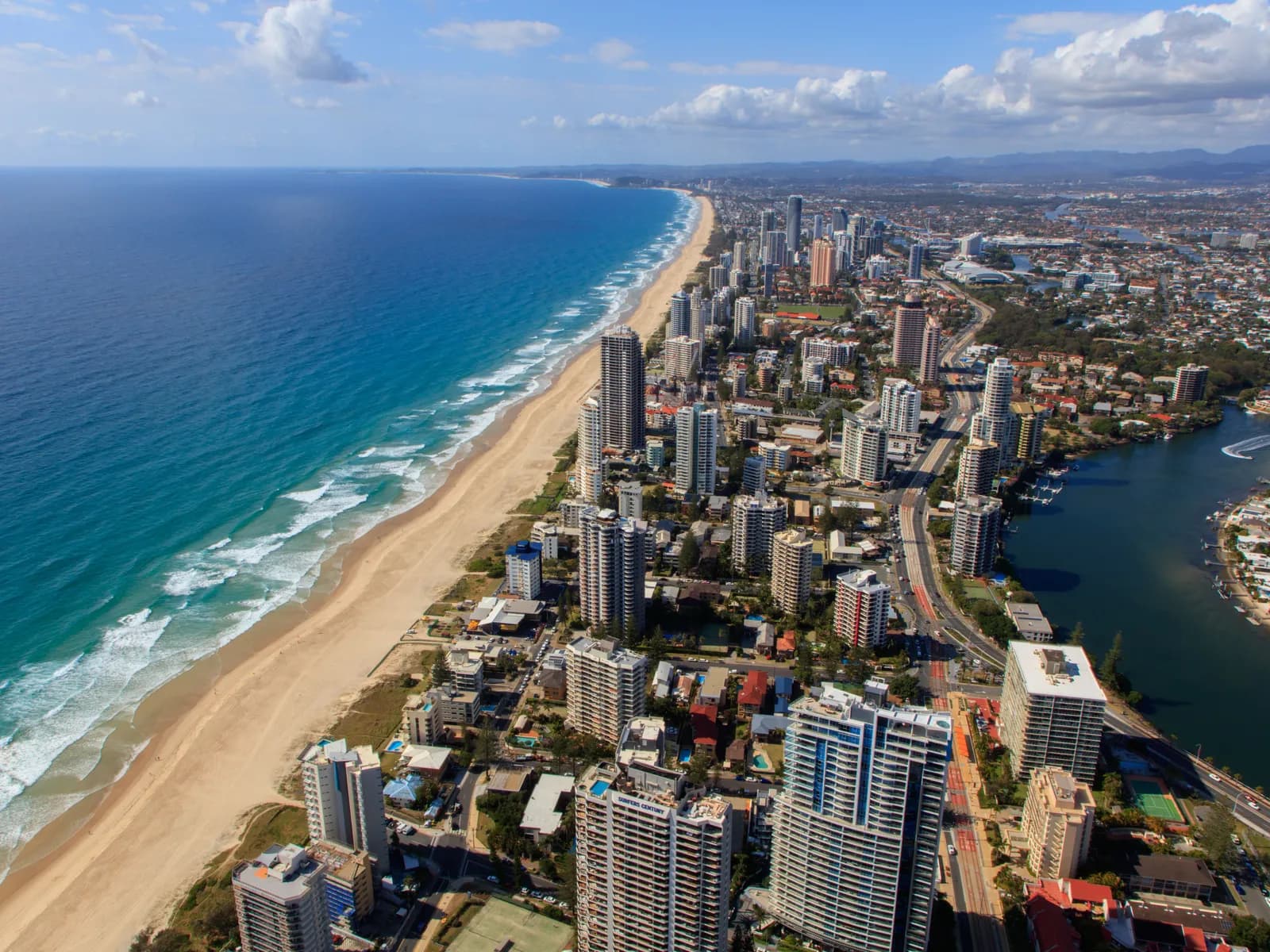 Aerial view of the Gold Coast beachfront and surf, representative of the Gold Coast region